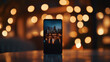 © CHRISTIANA - Smartphone displaying a city skyline at night with blurred bokeh lights