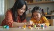 © Vitalii Zikun - happy indian mom building blocks with her baby