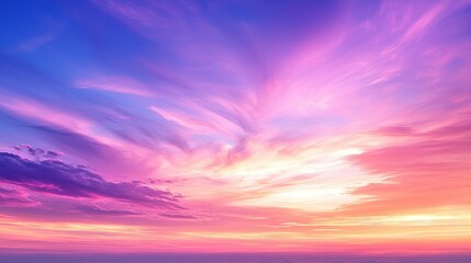 Wall Mural - Vibrant sky with pink, purple, blue hues, and wispy clouds during sunset or sunrise