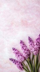 Poster - Delicate lilac blooms resting against soft pink textured surface, conveying gentle romantic spring ambiance with feminine elegance