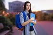 © BillionPhotos.com - A young happy woman student holds notebooks