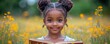 © diowcnx - Adorable African American girl with beautiful braided afro reading a book outdoors surrounded by nature showcasing the joy of learning and exploration in her black heritage
