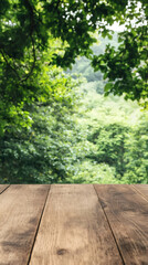 Poster - Empty wooden table resting against a blurred green forest backdrop, creating an ideal setting for showcasing products or displays