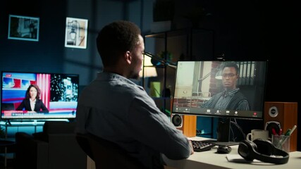 Wall Mural - black remote worker meeting with his team leader via video conference call, sharing ideas and insigh