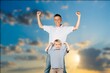 © BillionPhotos.com - Father holding son playing together outdoor
