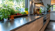 © Poonnoi - Narrow layout galley kitchen with stainless steel finish home cooking space modern design greenery bright ambiance functional aesthetics