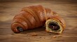 © Khaleej - Delicious Chocolate Croissant on Wooden Surface Tempting Pastry Treat