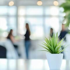 Poster - Plant in a Modern Office Environment with Blurred People in Background: A Minimalist and Refreshing Scene