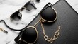 © DK Studio  - Monochrome Luxury Accessories Stylish sunglasses on a glittery black surface. Monochrome luxury accessories flat lay