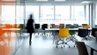 © julio - Motion Blurred Figure In A Modern Office With Colorful Chairs