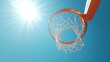 © Plaifah - A high-angle view of a basketball hoop and net against a clear blue sky, with the sun shining brightly and casting shadows on the court below