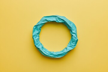 Leinwandbilder - Circular recycling loop symbolizing sustainable consumption on a bright yellow background with ample space for text