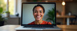 © MarkD - Smiling face on laptop screen during video call, happy face, positive