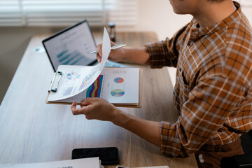Poster - Businessman working with documents analyzing financial data and economic growth reviewing statistics document