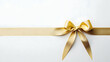 © reza - Gold Ribbon Tied On White Background