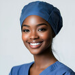 © Kootenay - Female Nurse Smiling in Blue Scrubs - Confident and Caring Healthcare Professional Portrait