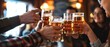 © LoomStock - Beer Toasting. Group of Friends Toasting Beer in a Pub. Celebrating with Cheers and Clinking Glasses. Social Gathering Concept on Background with Copy Space.