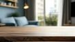 © reza - Empty Wooden Table With Blurred Background Of Modern Living Room Interior With Sofa Blue Couch And City View Through Window Perfect For Product Placement