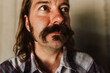 © Natalie Wheeler - Man with mustache looking up
