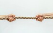 © creatfive - Two hands gripping opposite ends of a thick, textured rope against a plain white background. The image conveys a sense of struggle or competition