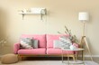 © Pixel-Shot - Beautiful interior of living room with sofa, coffee table and blooming branches