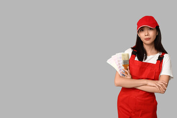 Wall Mural - female asian painter with paint color palettes and brush on grey background