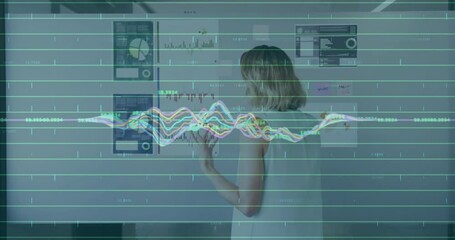 Wall Mural - in office, businesswoman talking on phone with animation of financial data graphs