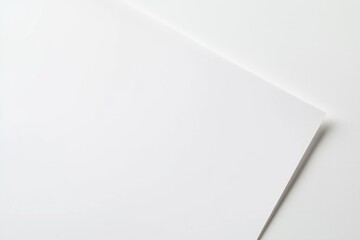 Wall Mural - Stark white paper sheet laid on a spotless white backdrop.