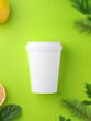© Nusaba - Refreshing Green Mockup: An overhead view of a minimalist paper cup stands centered on a vibrant green surface, subtly complemented by accents of fresh lemon and sprigs of greenery, creating a clean.