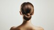 © Monchisa - Woman with Polished Low Bun Hairstyle Showcasing Elegance and Style