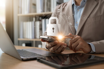 Wall Mural - cyber ​​security protecting sensitive business information, businessman using laptops and tablets sm