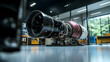 © jumino - A detailed engine assembly rests inside a modern workshop environment