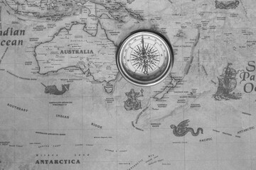 Wall Mural - classic round compass on background of old vintage map of world