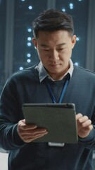 Wall Mural - portrait of happy asian it specialist using tablet coworking in successful data center supercomputer