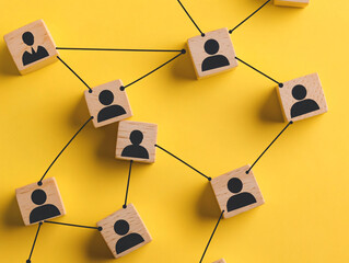 abstract network structure with interconnected icons on yellow background, conceptual digital commun