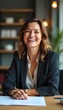 © Abdul Gatz.img - Smiling Woman in Office Setting Looking at Camera with Document