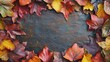 © Thanchanok - Colorful Autumn Leaves Surrounding Dark Textured Surface Background