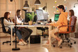 © Pixel-Shot - Team of female programmers working in office at night