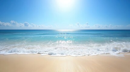 calm ocean waves under bright sun with clear blue sky and sandy beach in foreground copy space