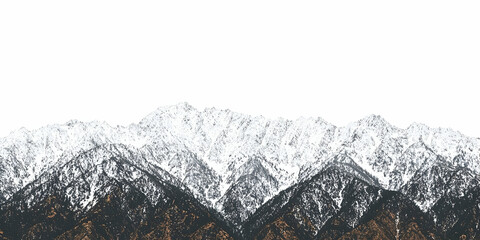 snowy mountain range against a white sky. winter landscape, ideal for travel brochures