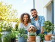 © sponge_Po - Happy couple gardening together with their dog in a sunny backyard
