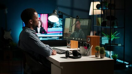 Wall Mural - black remote worker meeting with his team leader via video conference call, sharing ideas and insigh
