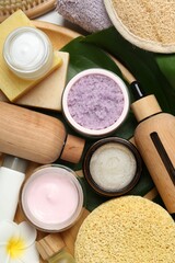 Wall Mural - different body care products, flower and bath accessories on light table, flat lay