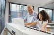 © offsuperphoto - Elderly man teaching his granddaughter to play the piano at home