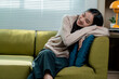 © PaeGAG - Happy asian woman lying on sofa enjoying weekend at home, relaxing on comfortable couch