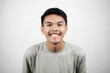 © Rizky Rianto - Portrait of asian man showing excited expression, young man isolated on white background