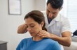 © PirisaTK - Chiropractor performing neck adjustment on patient clinic setting wellness treatment indoor environment professional viewpoint