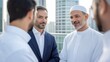 © Arx PhotoStock - Middle Eastern businessmen discussing a deal on a rooftop with city background