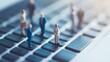 © dong - Miniature Business Figures on Keyboard: Representing Teamwork and Business Collaboration in a Digital Workspace.