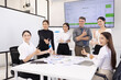 © SOMKID - Happy excited business teamwork with marketing strategy analysis in meeting room at office, Business people working together in creative office, Business group celebrating in boardroom meeting.